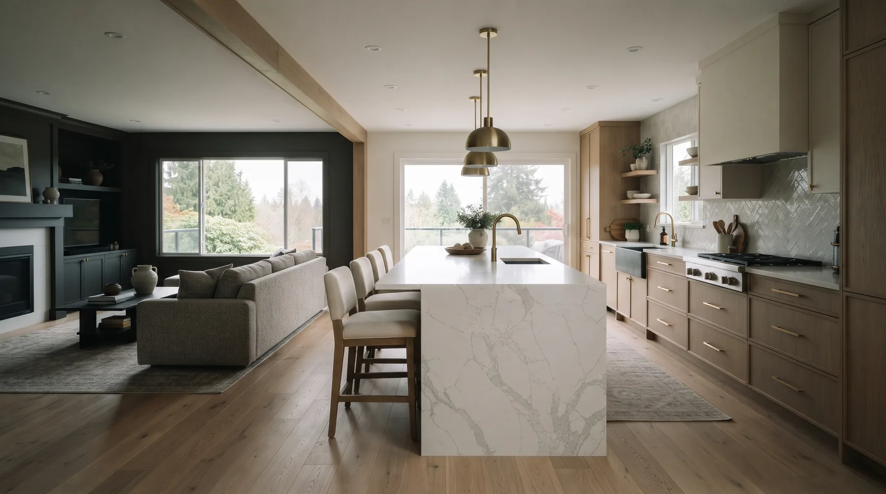 Open-concept kitchen with a waterfall island flowing into a living area